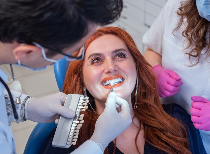 Dentist checking for white dental implant on a patient - S&L Dental