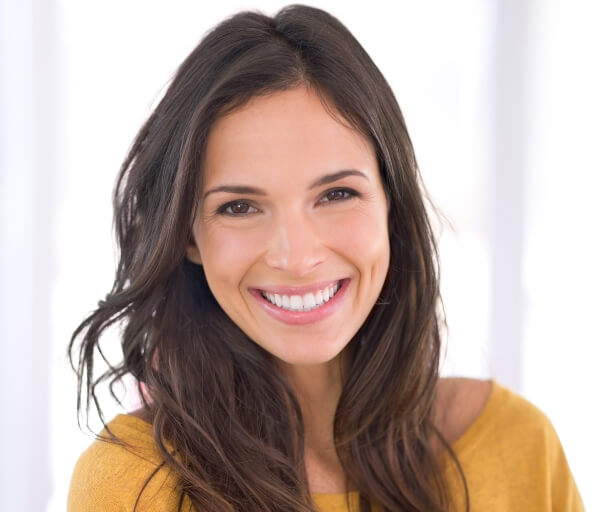 Female with a Beautiful Smile after Dental crown service - S&L Dental