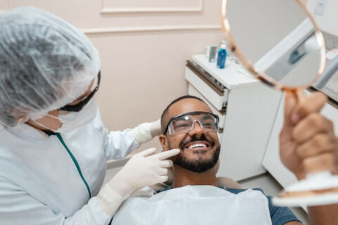 Smiling Patient after Wisdom tooth Extraction Recovery - S&L Dental