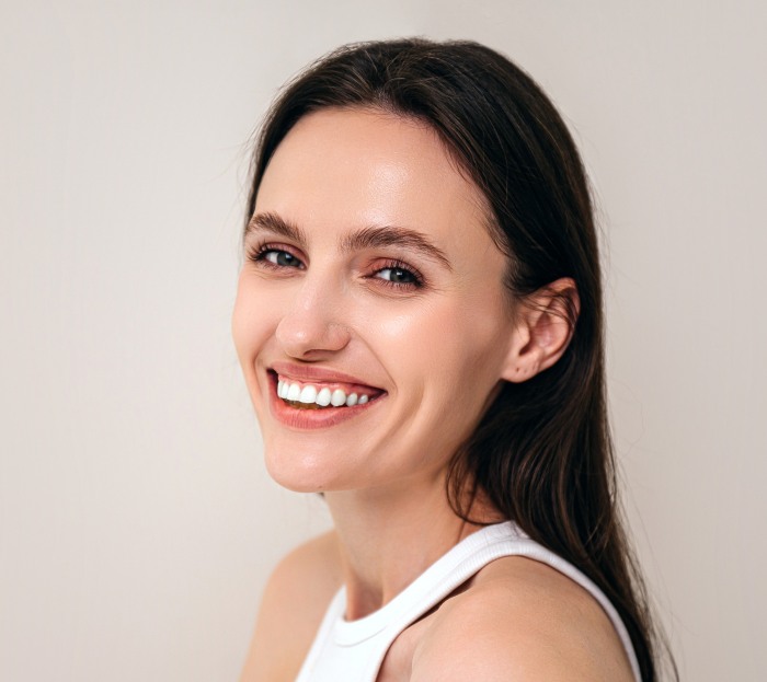 Woman with a perfect and beautiful smile - S&L Dental