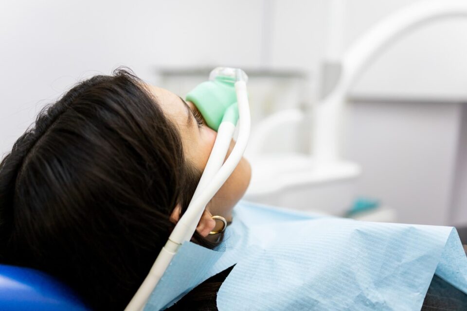 A person with an oxygen mask on her face