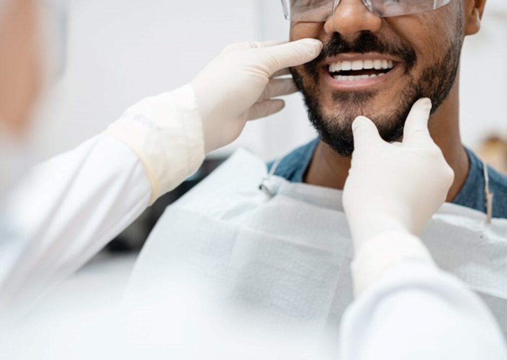Dentist checking the Oral hygiene of a patient – S&L Dental