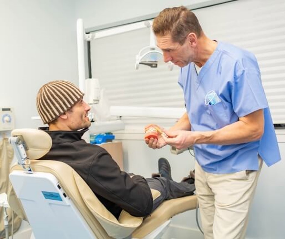 Dentist talking to patient