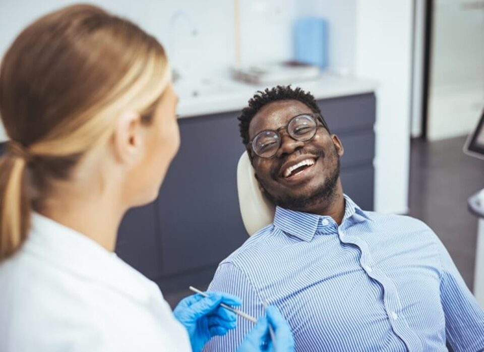 man smiling at dentist