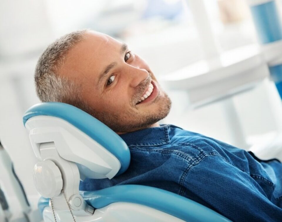 man smiling in dental chair