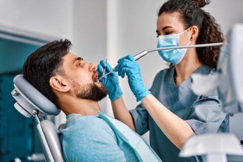A dentist examining a patient's teeth