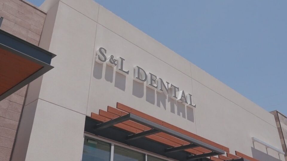 The S&L Dental sign on the front of the office building on North Scottsdale Road